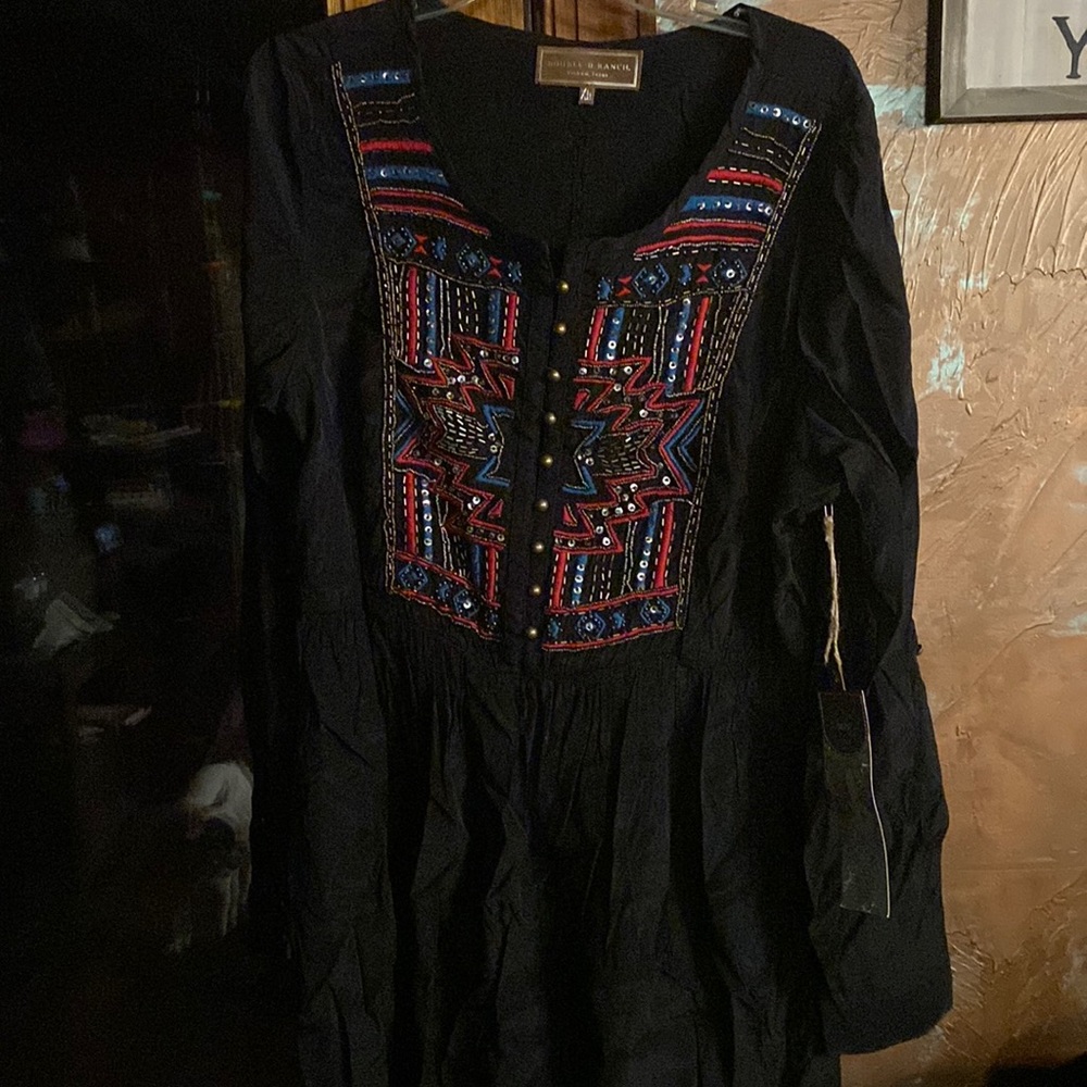 Double D tunic faded in spots in the sun on out side rack